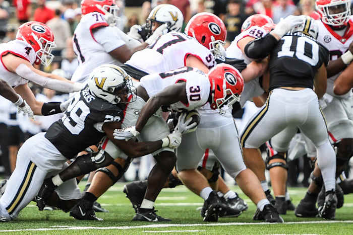 Oct 14, 2023; Nashville, Tennessee, USA; Georgia Bulldogs running back Daijun Edwards (30) dives into the end zone against the Vanderbilt Commodores during the second half at FirstBank Stadium. Mandatory Credit: Steve Roberts-USA TODAY Sports